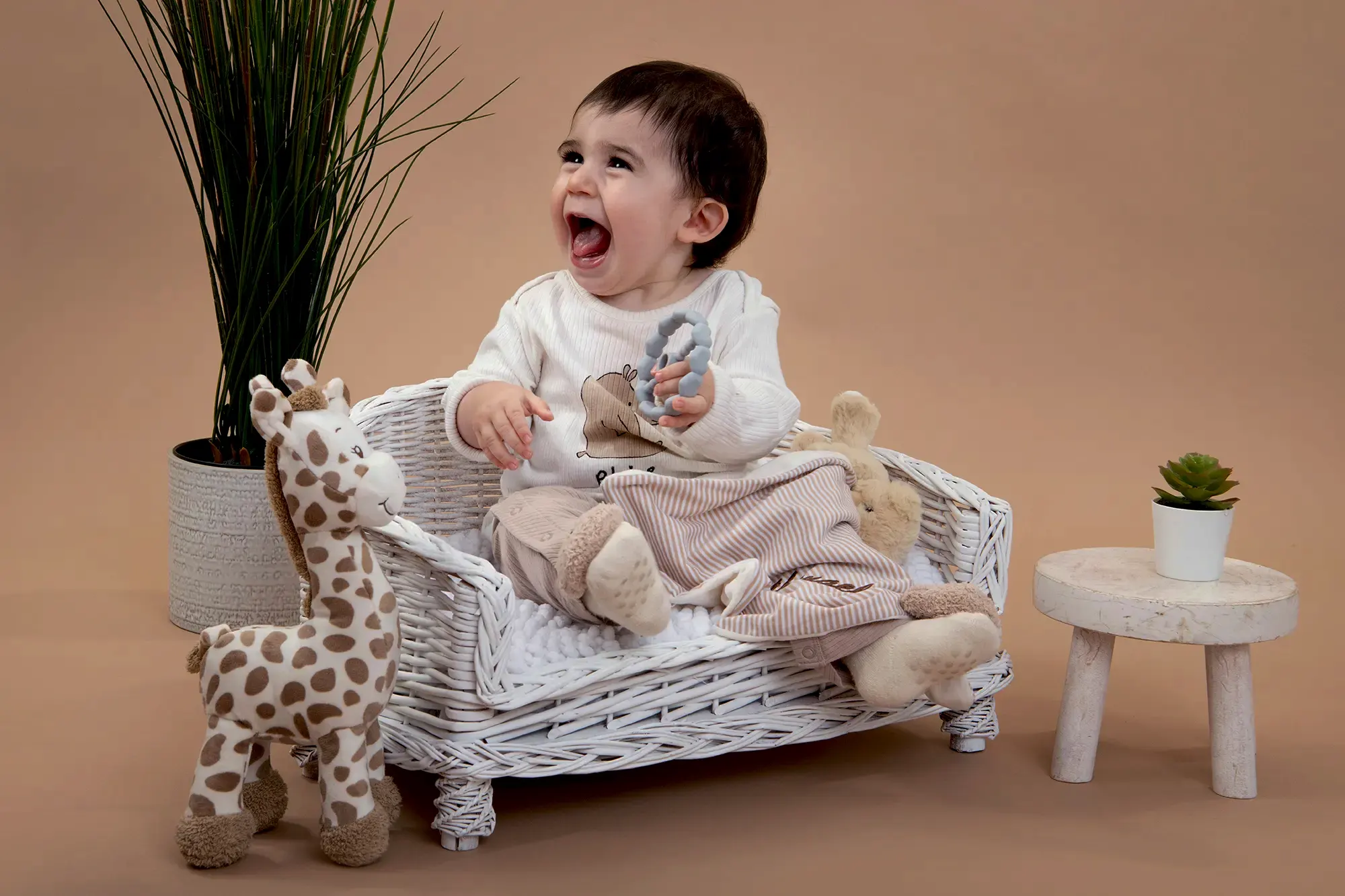 Joyful baby in a vibrant studio setup at Sky Portraits, Sydney - baby photography session