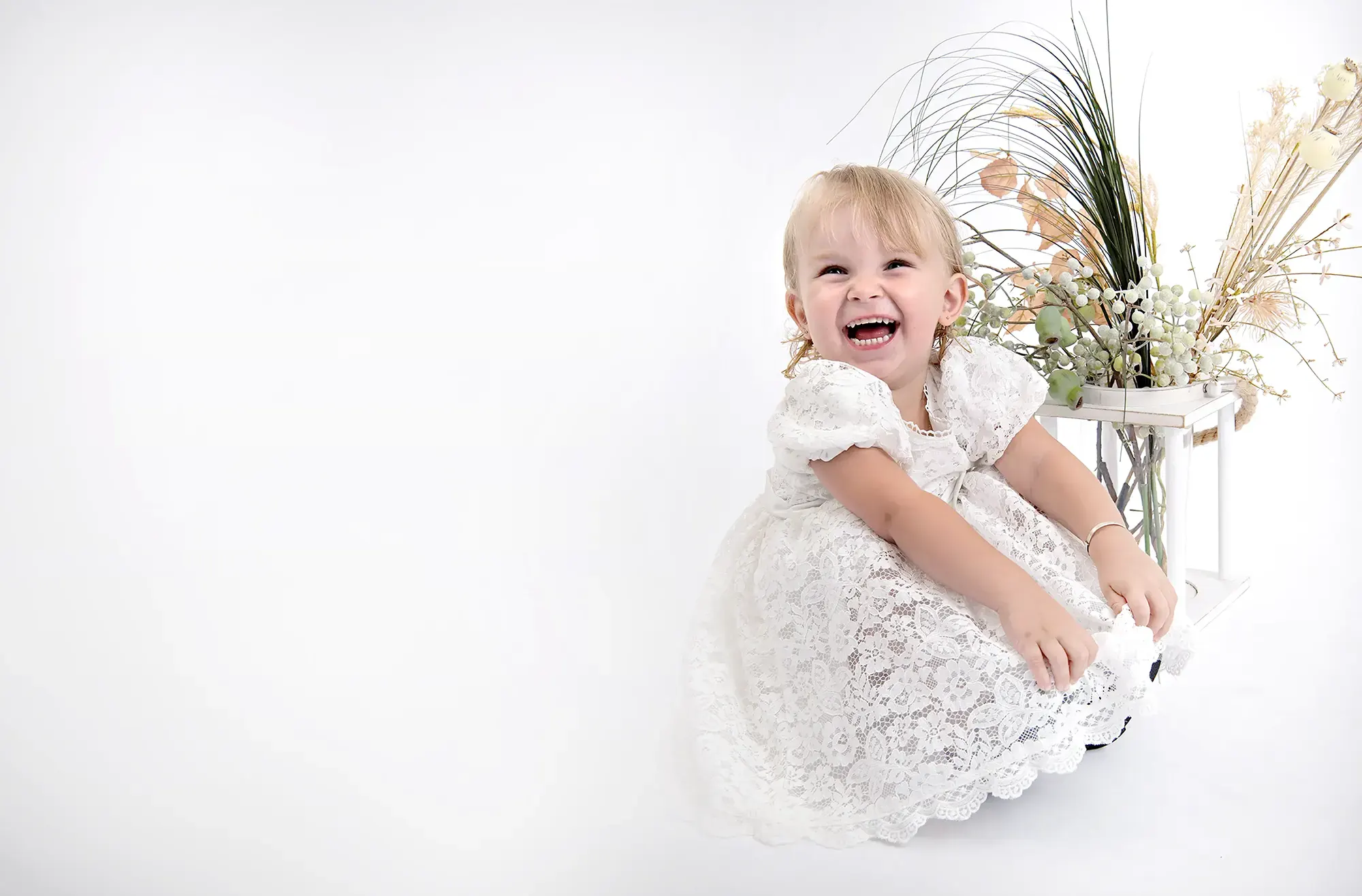 Playful baby captured at Sky Portraits in St Leonards, Sydney - creative baby photography