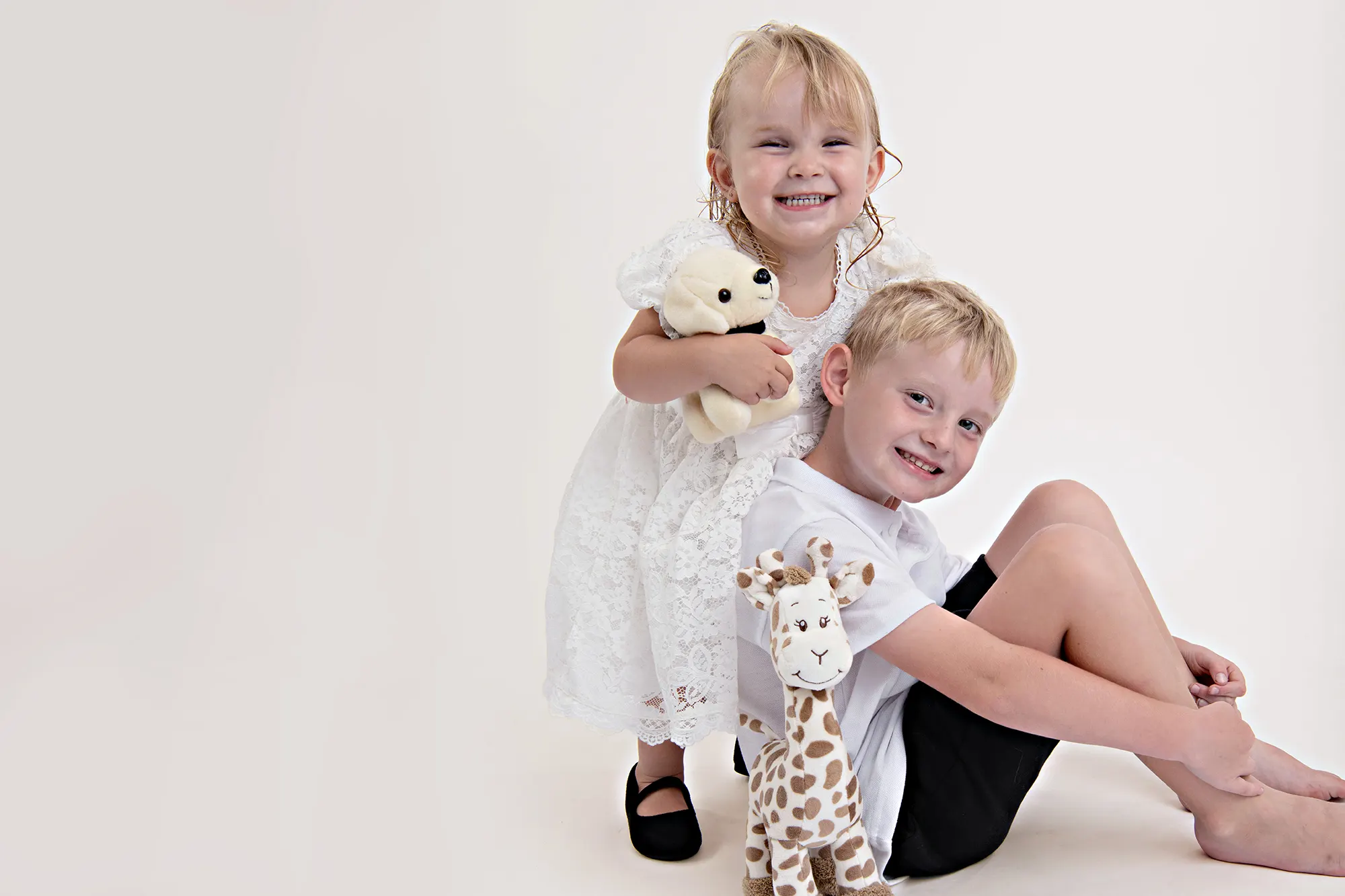 Newborn twins cuddling in cozy setup at Sky Portraits, Sydney - twin newborn photographer