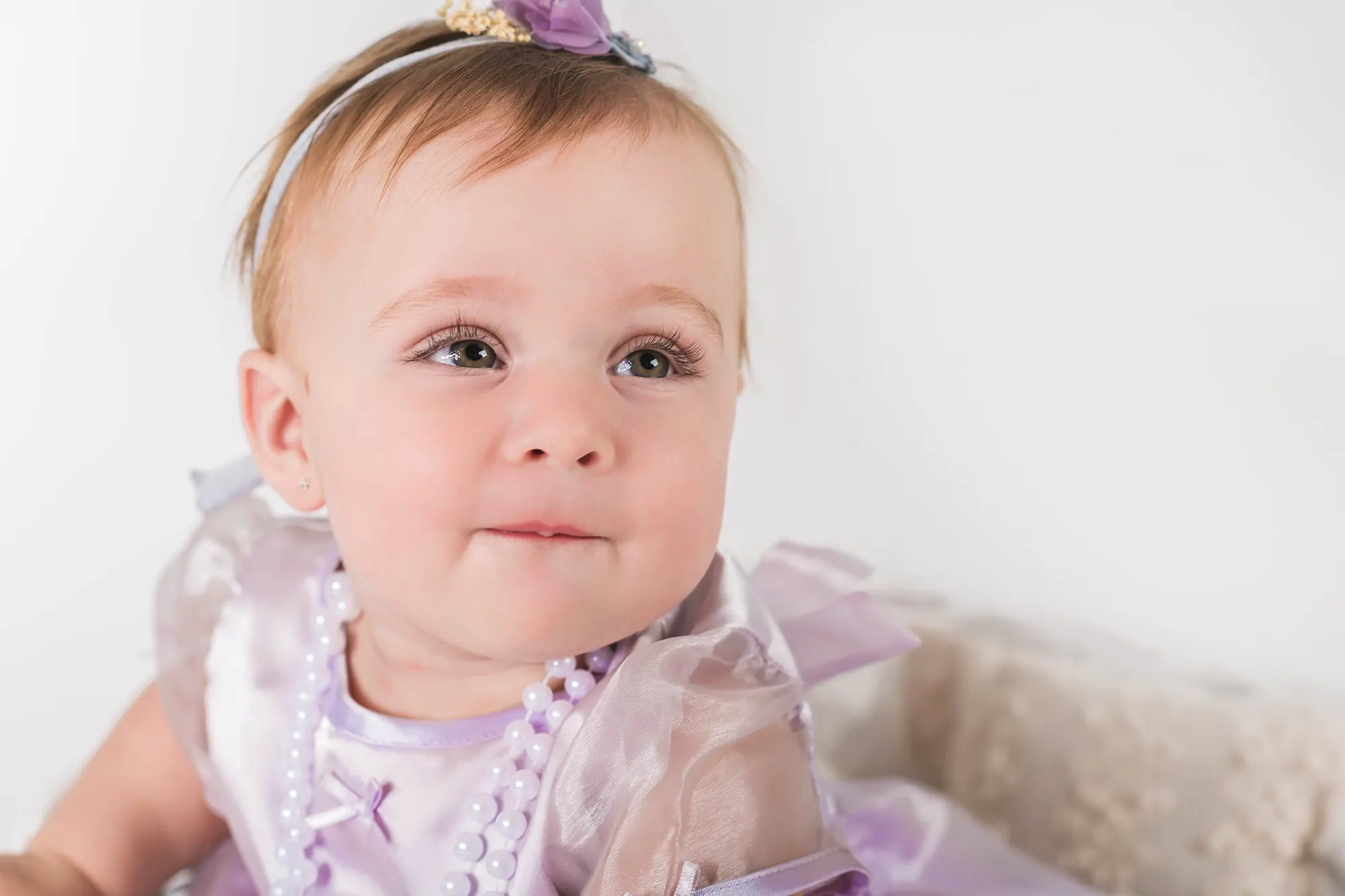 Cheerful baby playing with toys at Sky Portraits Studio, North Shore, Sydney - baby photoshoot