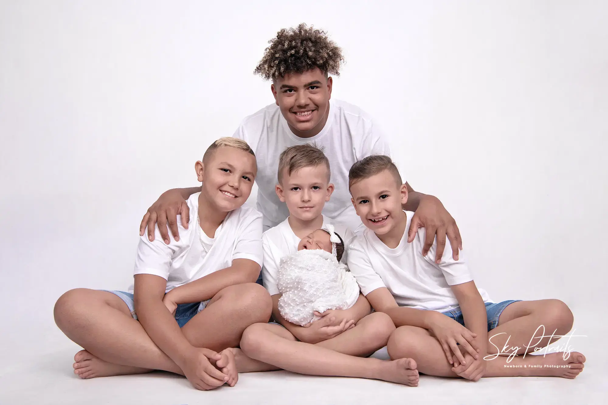 Heartwarming family studio portrait at Sky Portraits in Sydney, Australia - family photographer