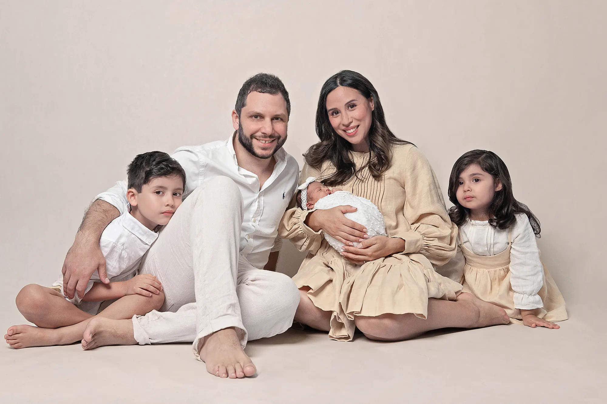 Family of three enjoying studio session at Sky Portraits, Sydney - fun family photographer