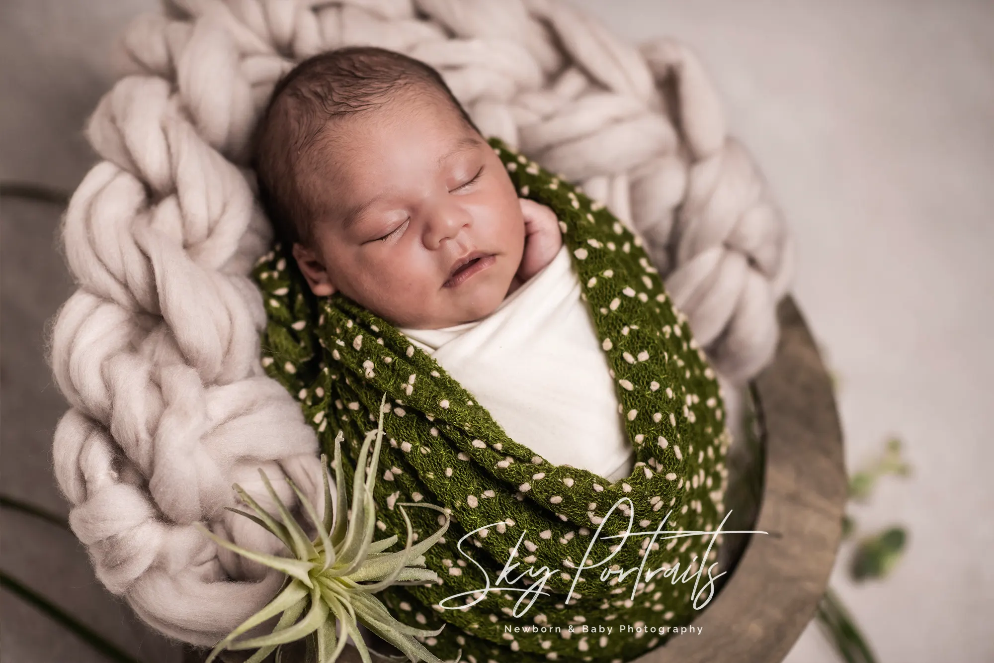 Peaceful newborn resting on fur throw at Sky Portraits Studio, Sydney - newborn photography