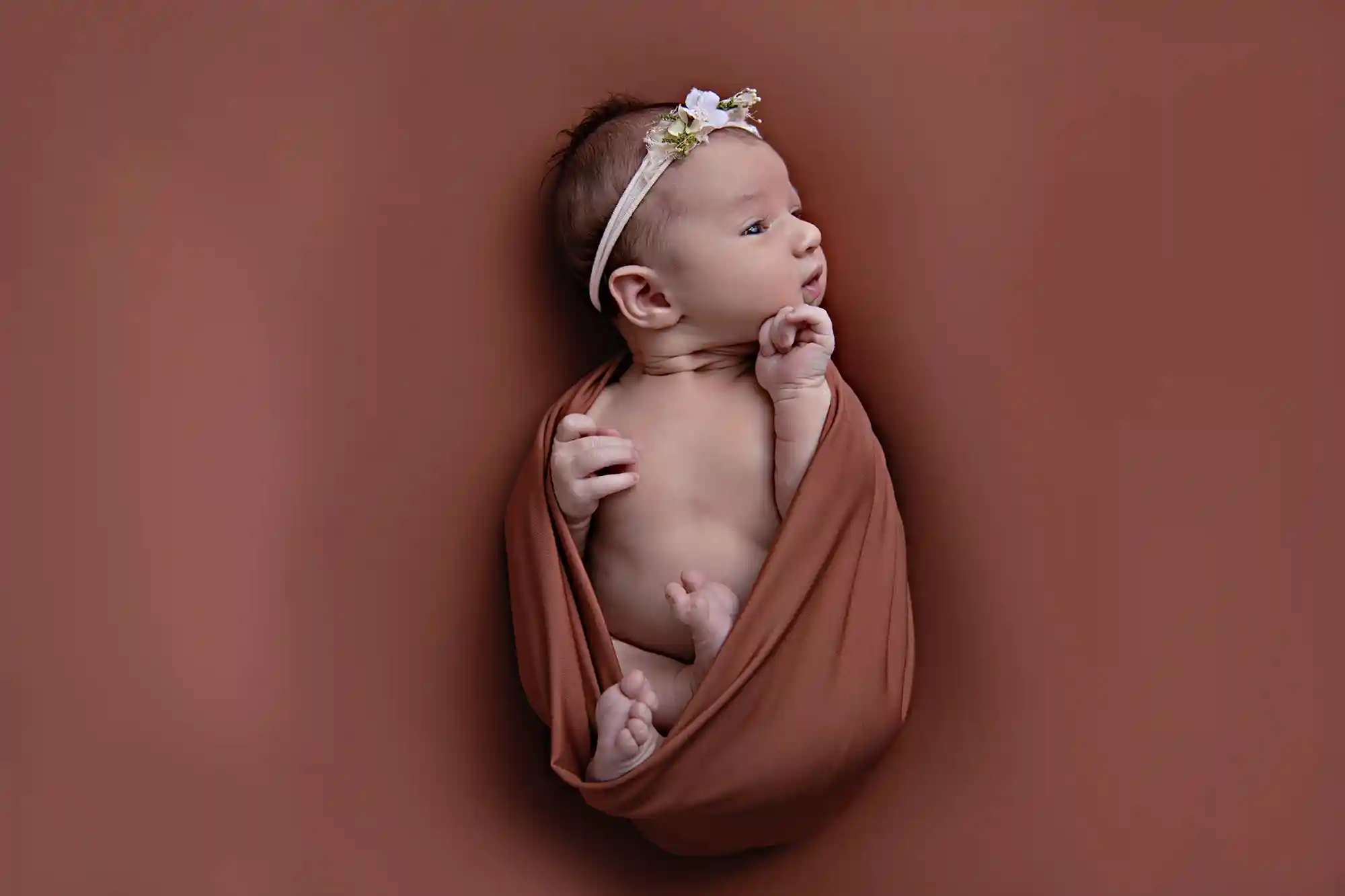 Peaceful newborn resting on fur throw at Sky Portraits Studio, Sydney - newborn photography