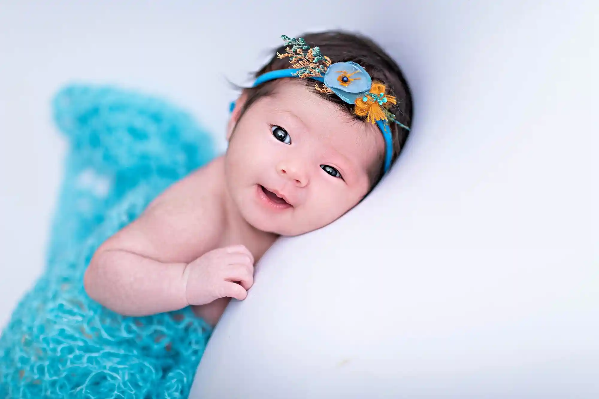 Serene newborn wrapped in natural tones at Sky Portraits, Sydney - newborn photography session