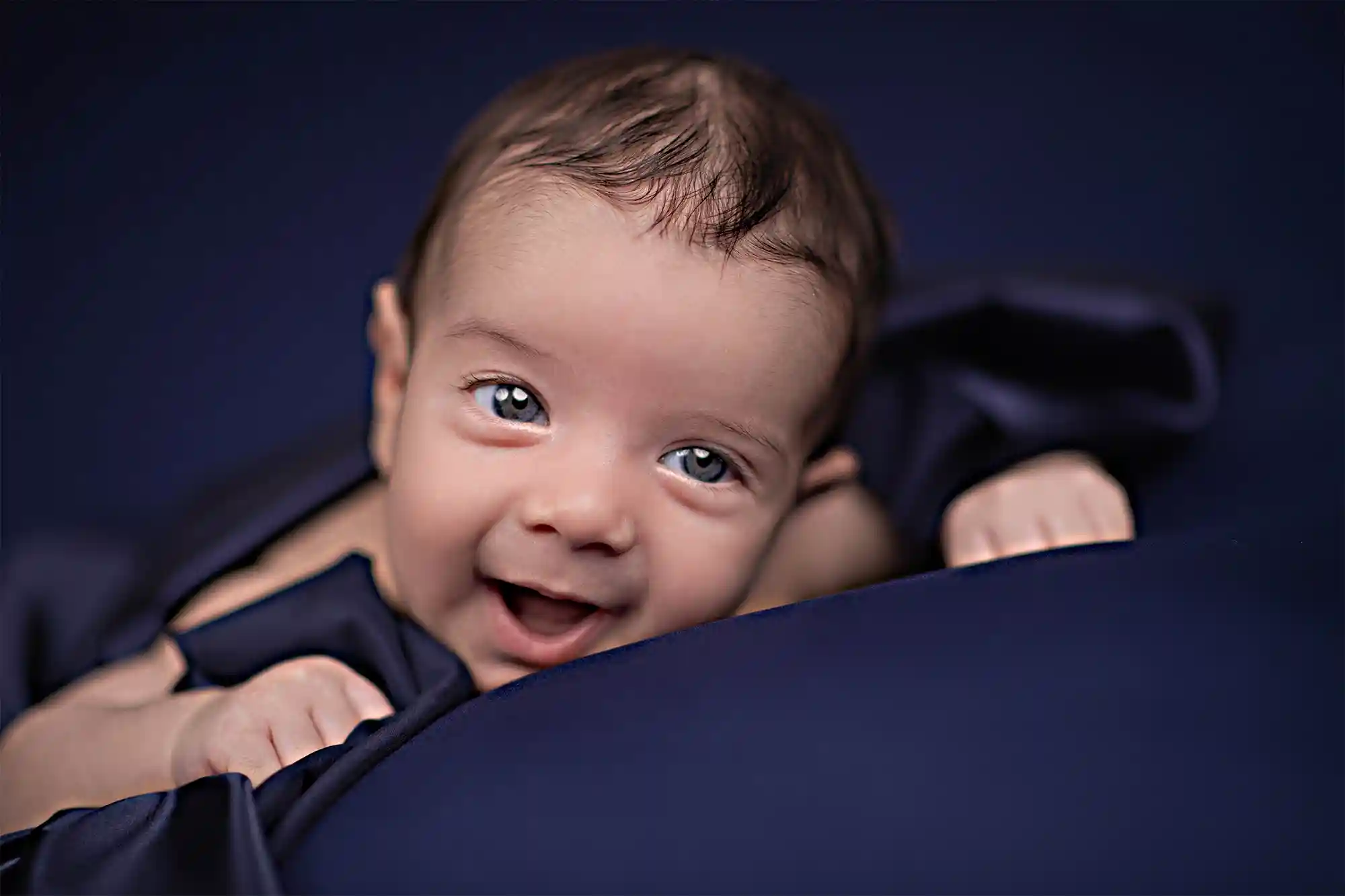 Peaceful newborn resting on fur throw at Sky Portraits Studio, Sydney - newborn photography