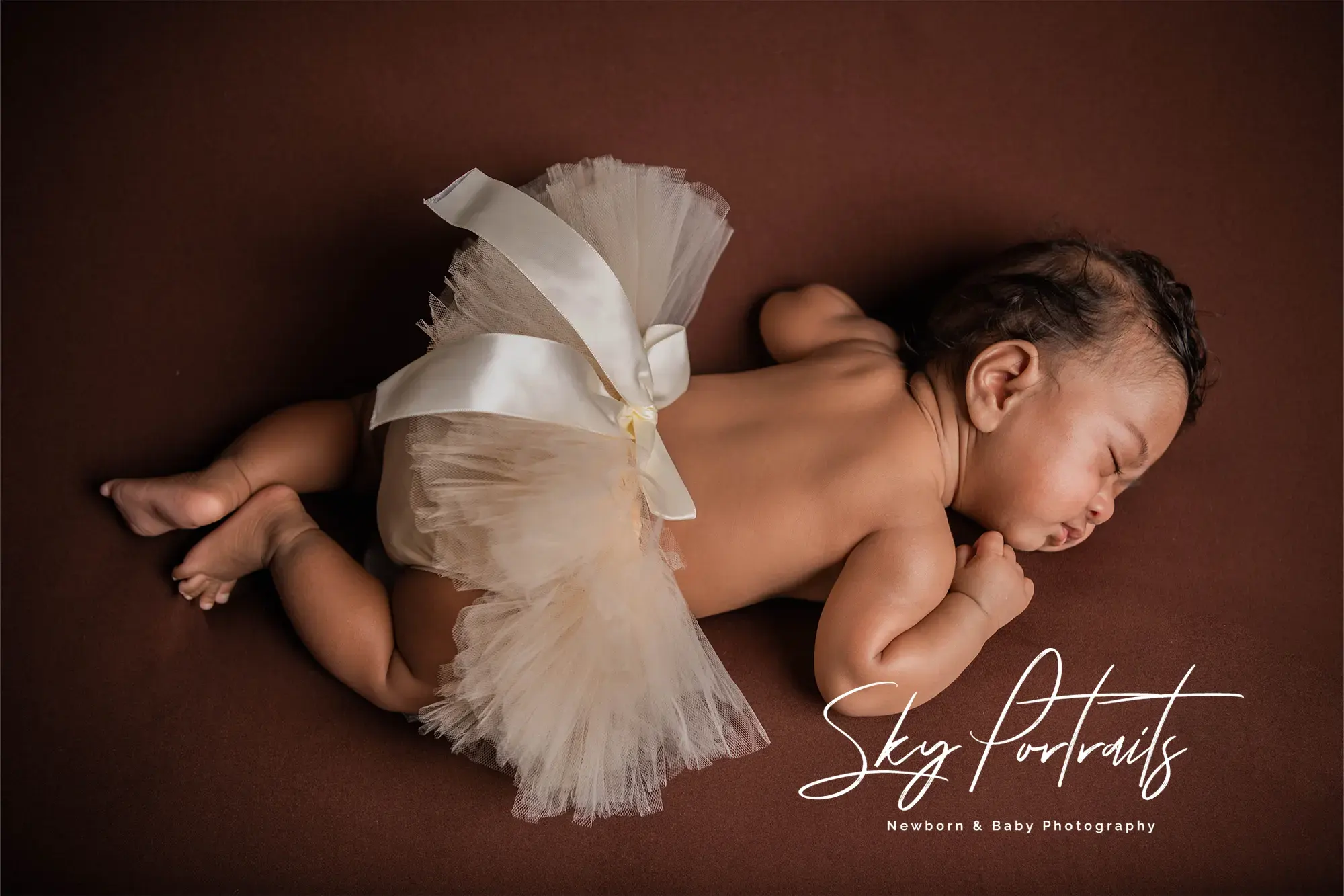 Cozy newborn session in basket at Sky Portraits, Sydney - creative newborn photography