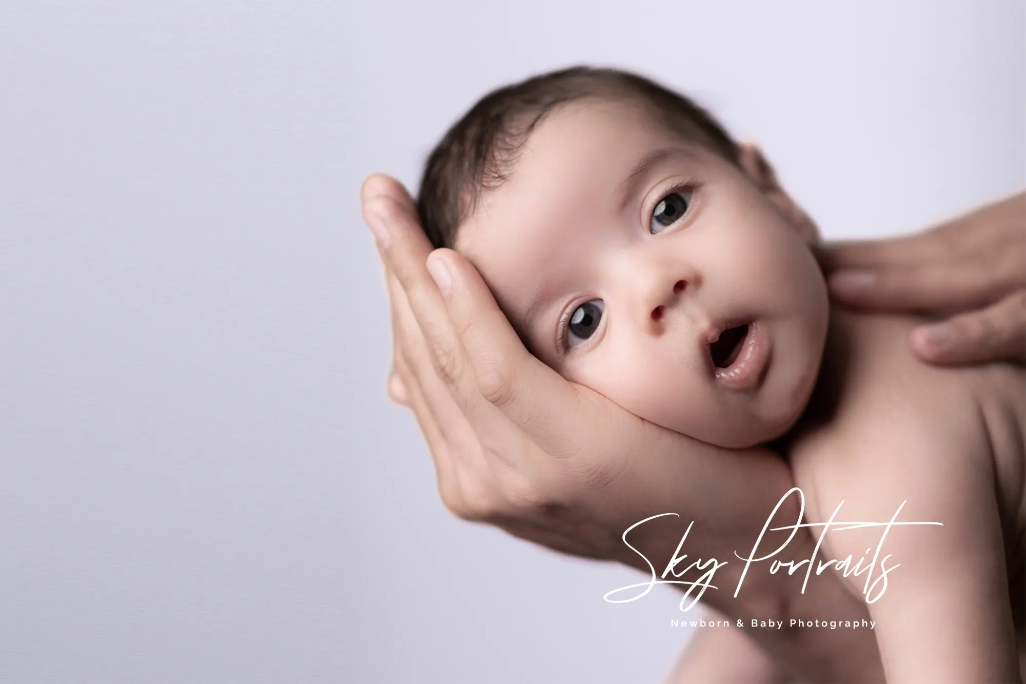 Peaceful newborn resting on fur throw at Sky Portraits Studio, Sydney - newborn photography