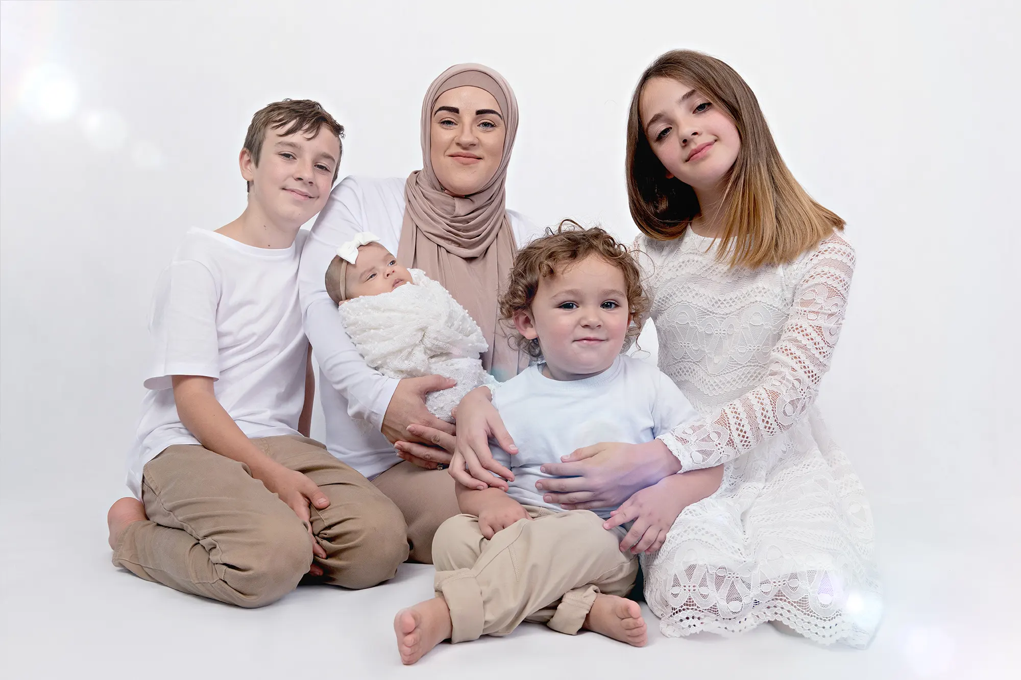 Kya Vis with her kids in a heartwarming family photograph by Sky Portraits